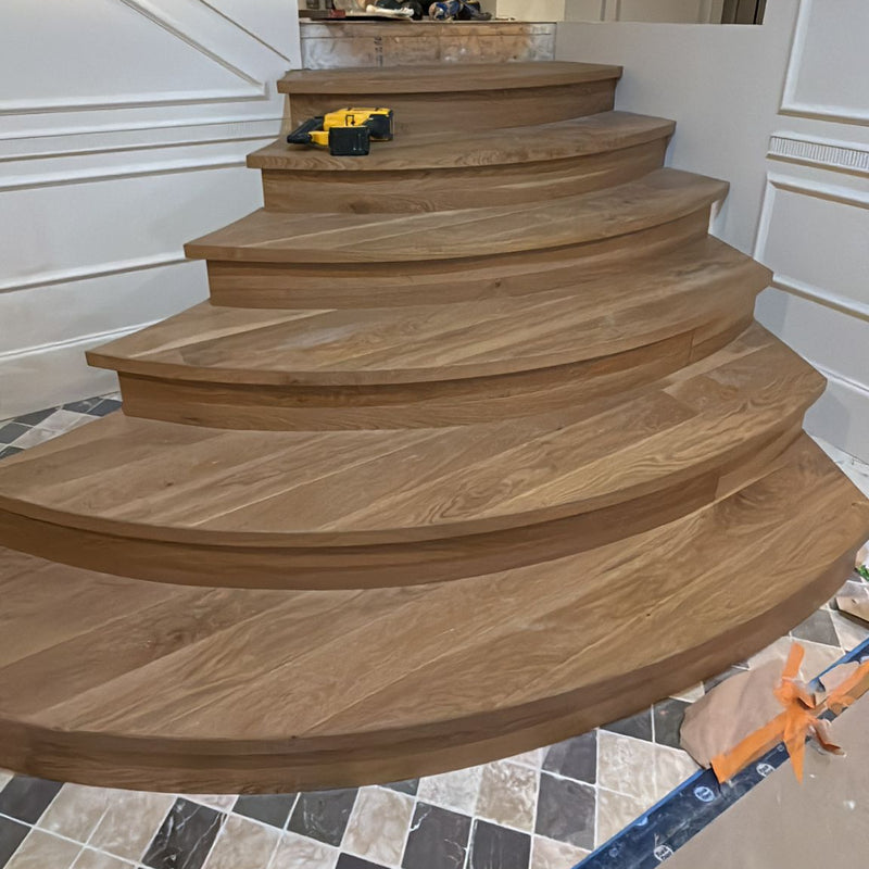 CUSTOM MADE CURVED STAIRS MADE FROM THE CLIENTS MATERIAL.  INSTALLED BY THE WEST COAST HOMES